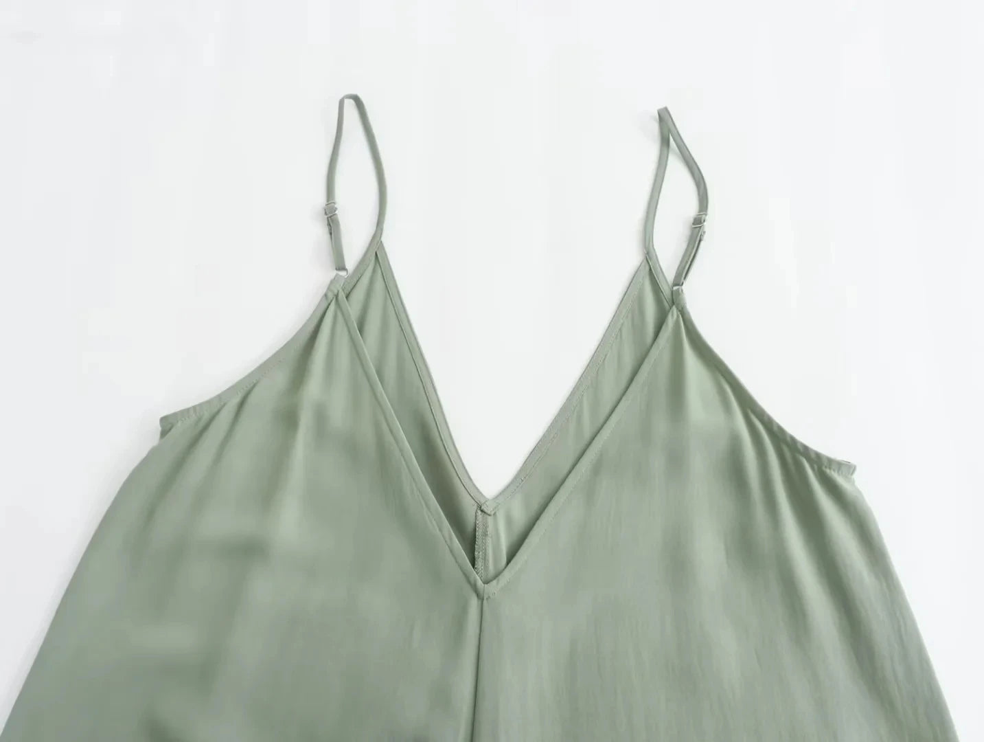 Sleeveless slip dress with thin straps.
