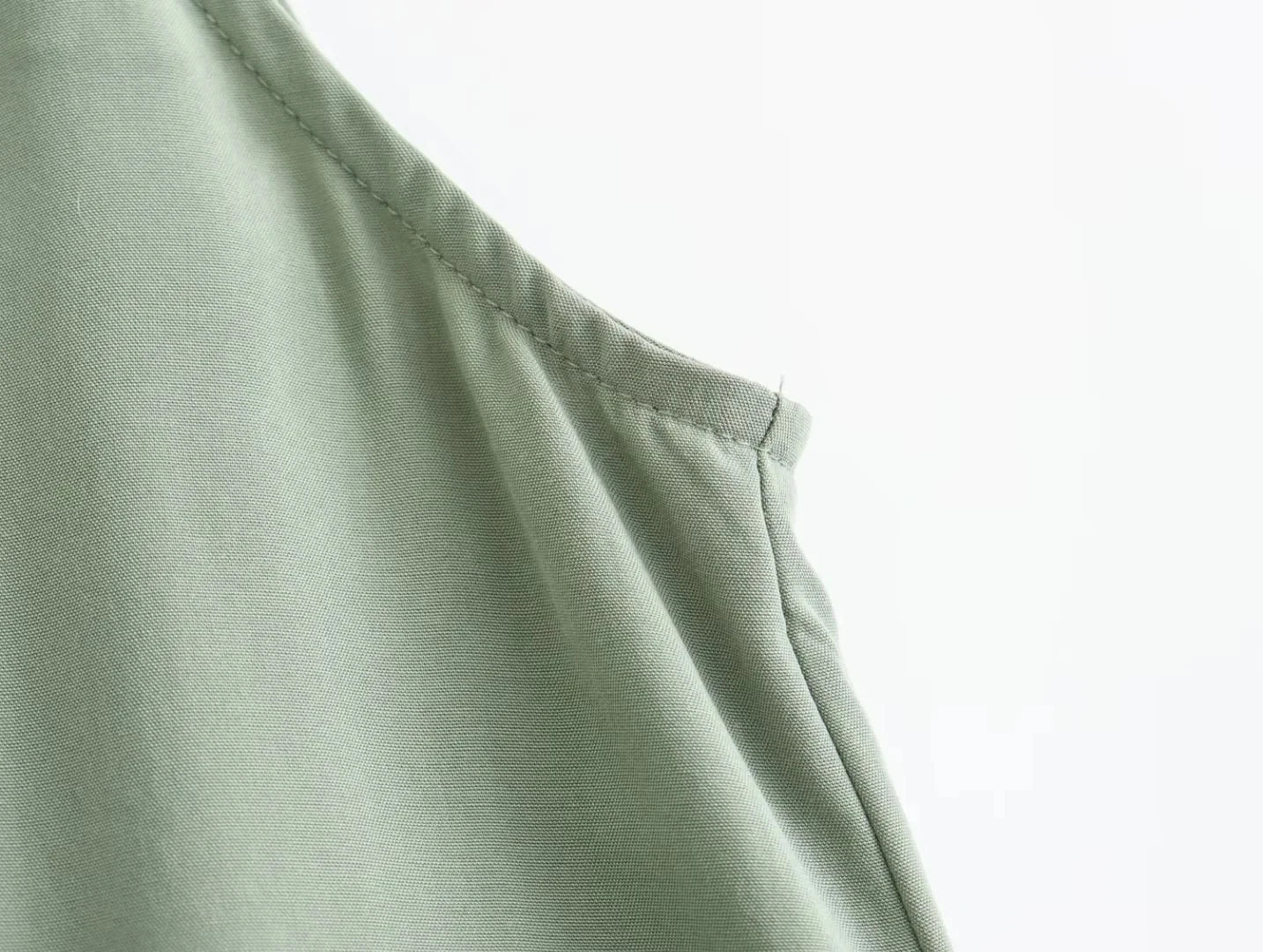 Sleeveless slip dress with thin straps.